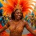 A joyful woman in a vibrant orange feathered headdress and jeweled costume dancing in a lively carnival festival parade.
