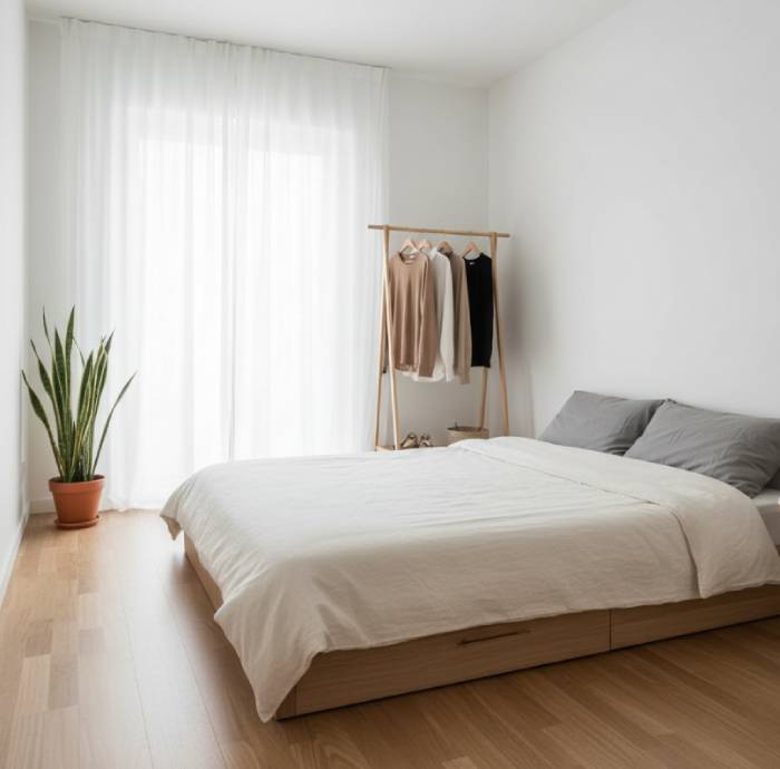 Minimalist living space with simple furniture, neutral tones, and clutter-free design